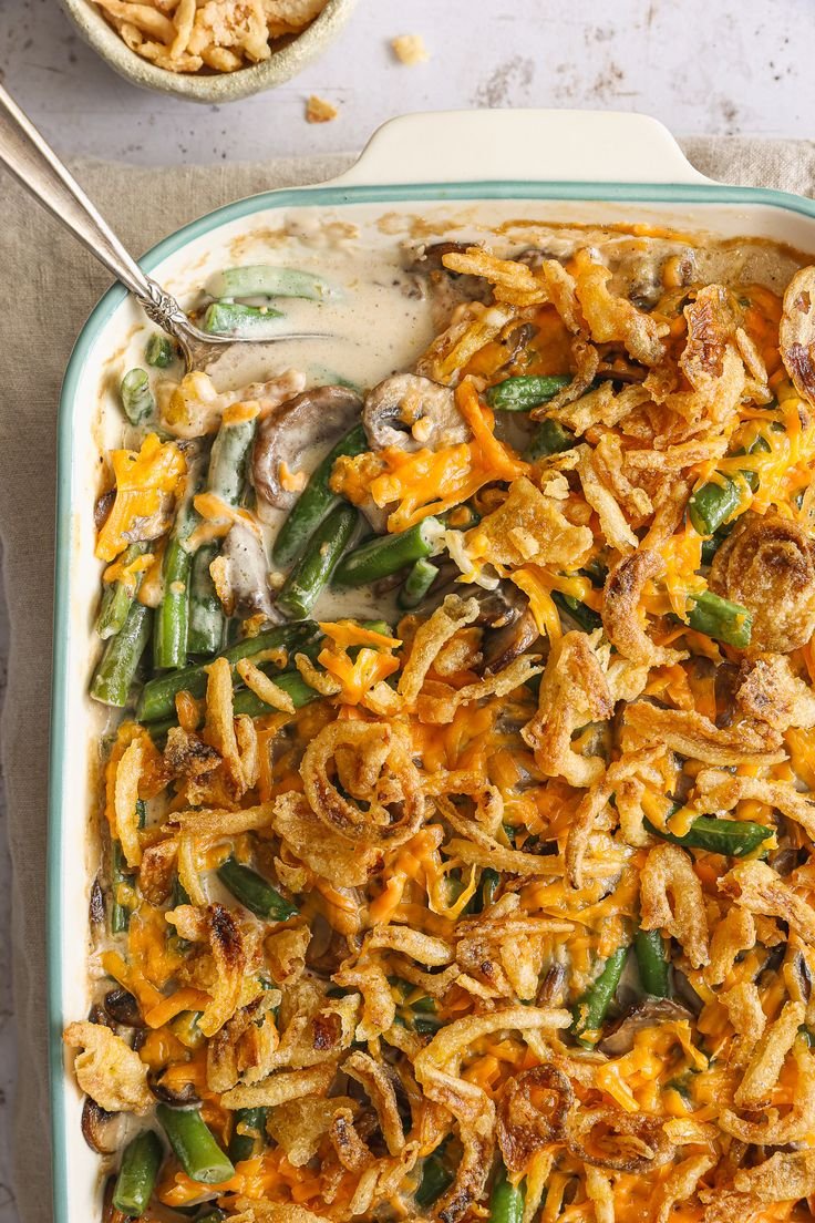 Green Bean Casserole with tender green beans, creamy mushroom sauce, and topped with crispy fried onions