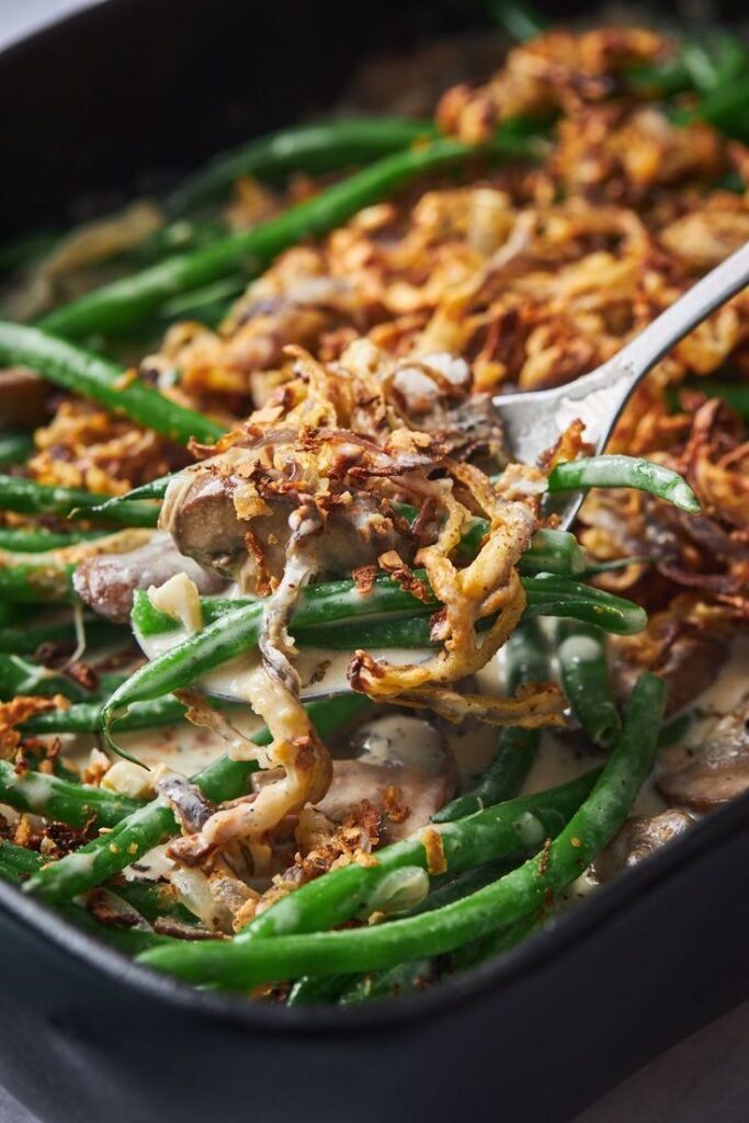 Green Bean Casserole with tender green beans, creamy mushroom sauce, and topped with crispy fried onions