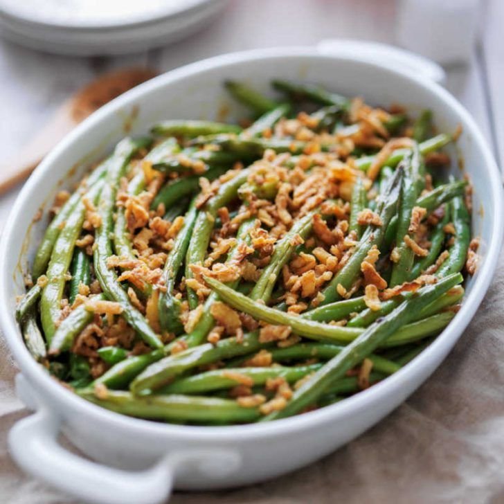 Green Bean Casserole with tender green beans, creamy mushroom sauce, and topped with crispy fried onions